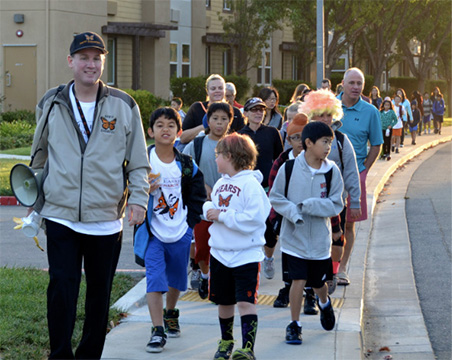 kids walking down sidewalk