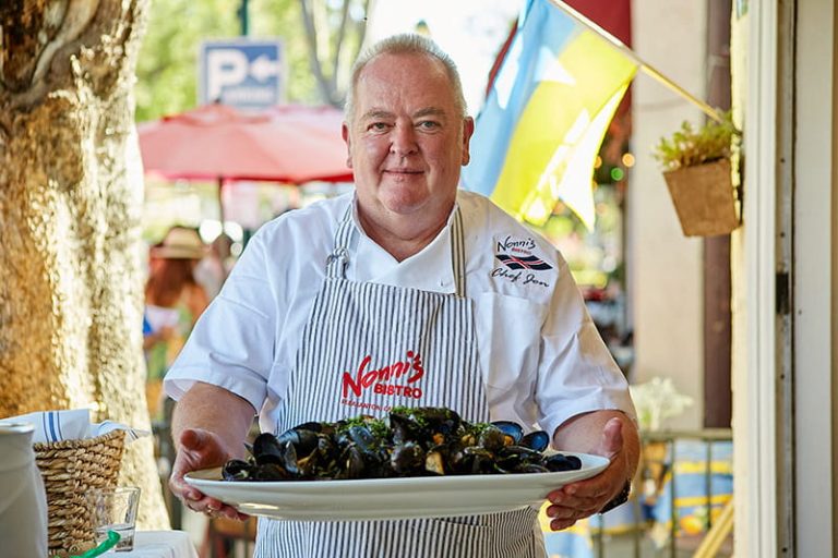 Chef with a plate of mussels