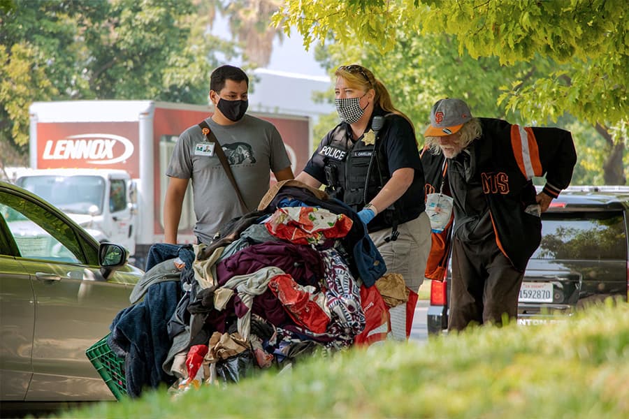 homeless man with police officers